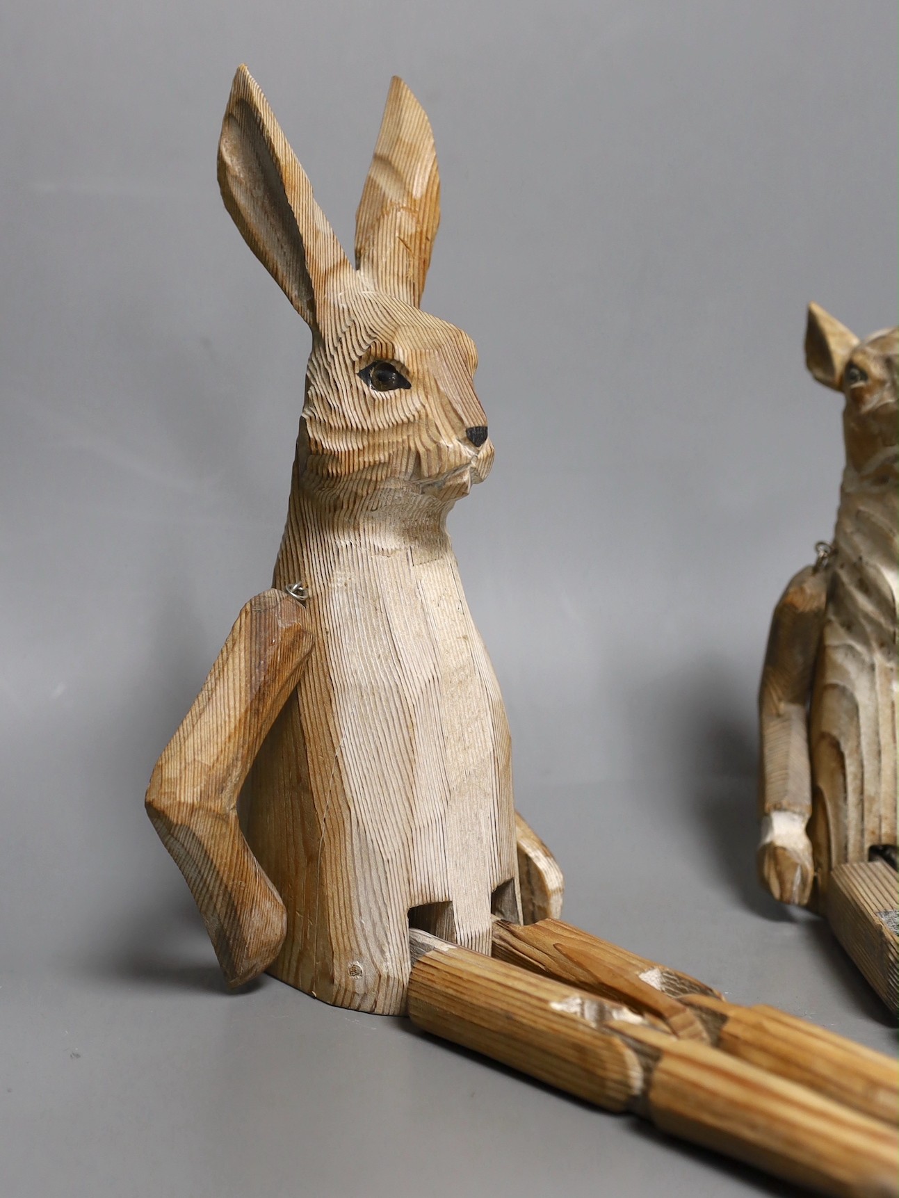 A pair of carved wood animal peg dolls, a hare and a sheep, hare tallest, 43cms high